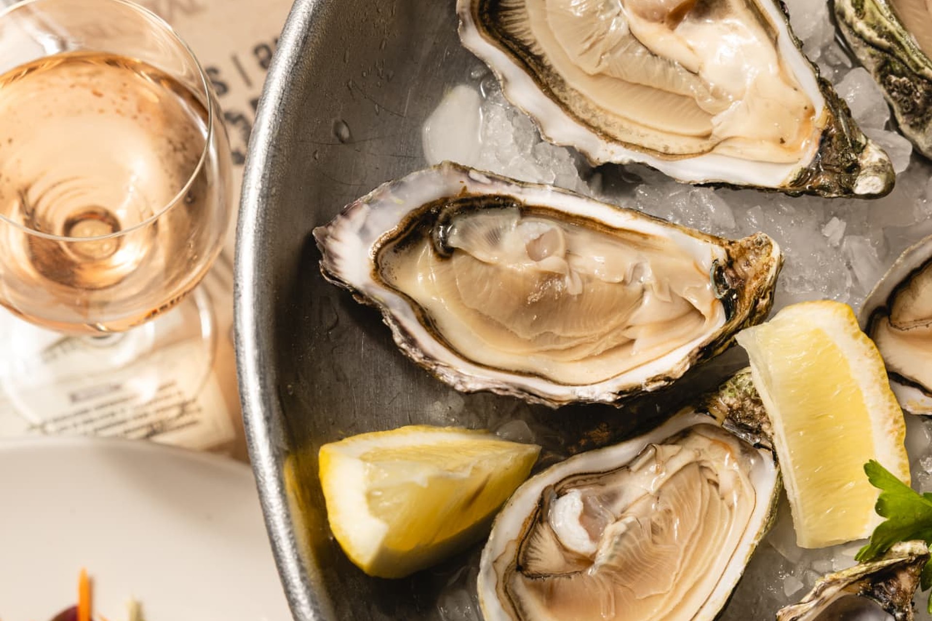 Seafood plated on stone in an Ostricaio Group dining room